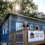 Amy Blank Wilson standing in front of a Tiny Homes Village home