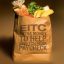 graphic image of grocery bag with, "Earned Income Tax Credit (EITC) extra money to help stretch your paycheck" written on it.