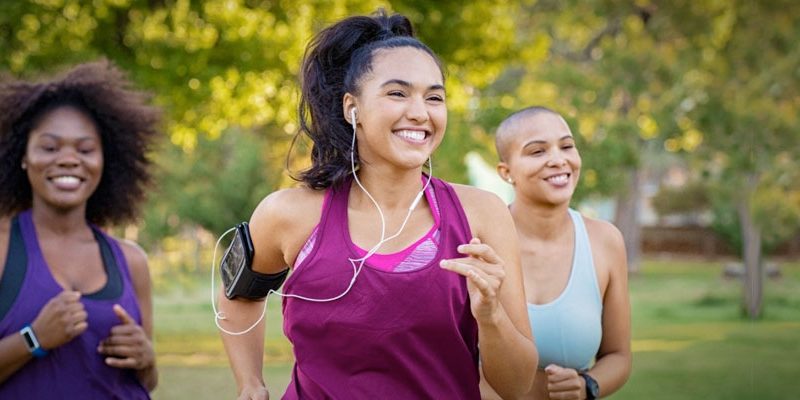 Black women jogging with context on weight management.