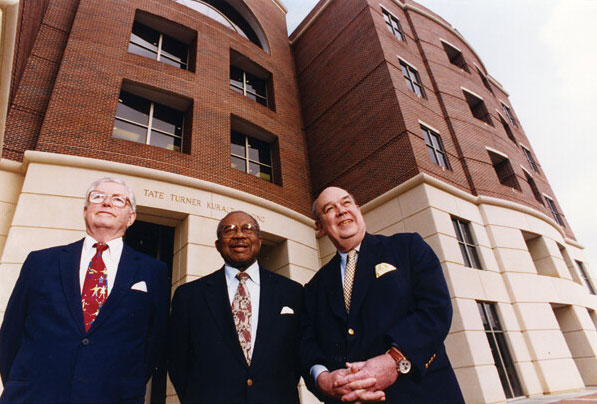 Our building namesakes at its dedication in 1996: businessman Jack Tate, former dean John Turner, and legendary journalist Charles Kuralt.