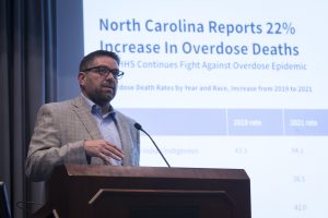 Associate Professor Paul Lanier speaks during a panel discussion on advancing equity in substance use disorder treatment and recovery.