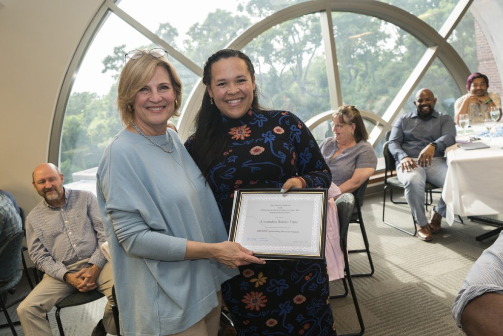 Alexandria Forte, right, was awarded the Outstanding Doctoral Student Award for 2023. She poses with Ph.D. Associate Dean Mimi Chapman.