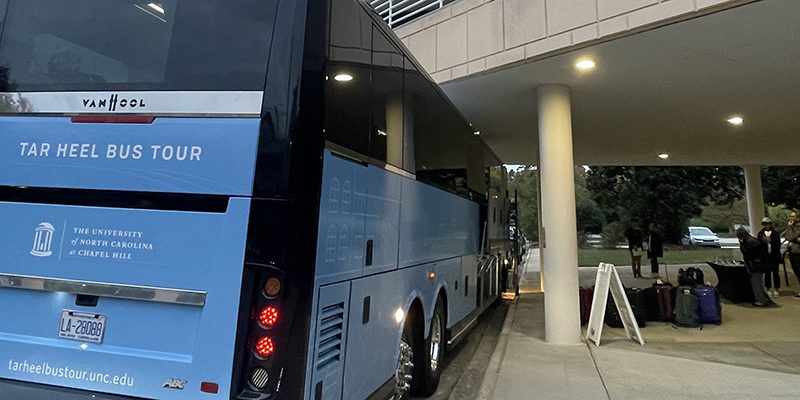 The 2023 Tar Heel Bus Tour made 21 stops over three days across eastern and western North Carolina. One of the two buses prepares to load up for the trip.