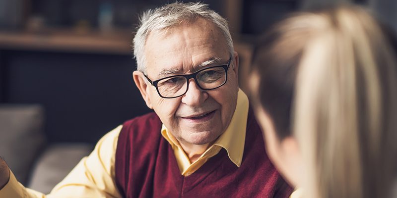 A home health care provider visits a senior patient at his home.
