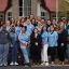 A group of UNC School of Social Work students and faculty members pose outside of the Lumbee Tribe headquarters in Pembroke, N.C.